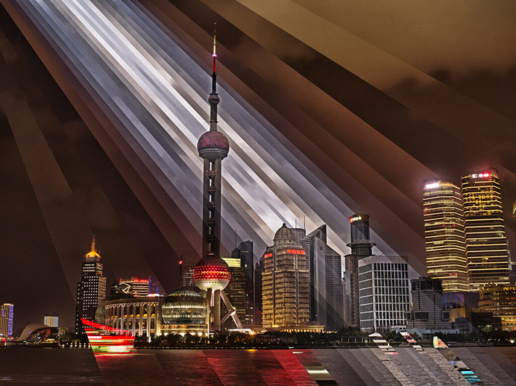 Shanghai’s Oriental Pearl Tower at night under rays of the sunset sky