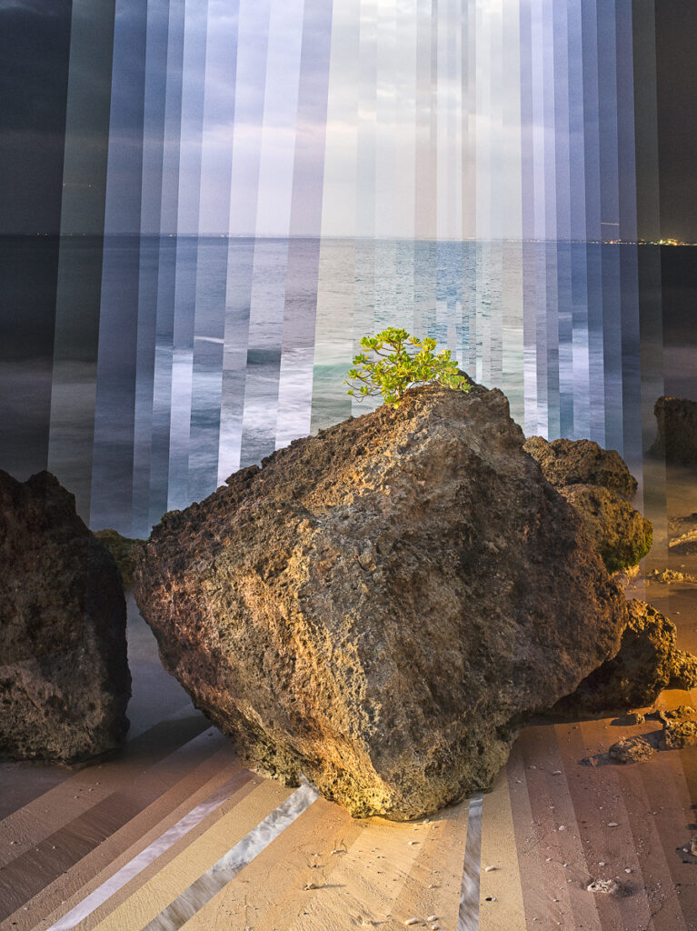 A rock on a Bali beach, the sea and sky behind it cut into vertical bands of different times